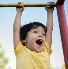 Boy playing on money bars.